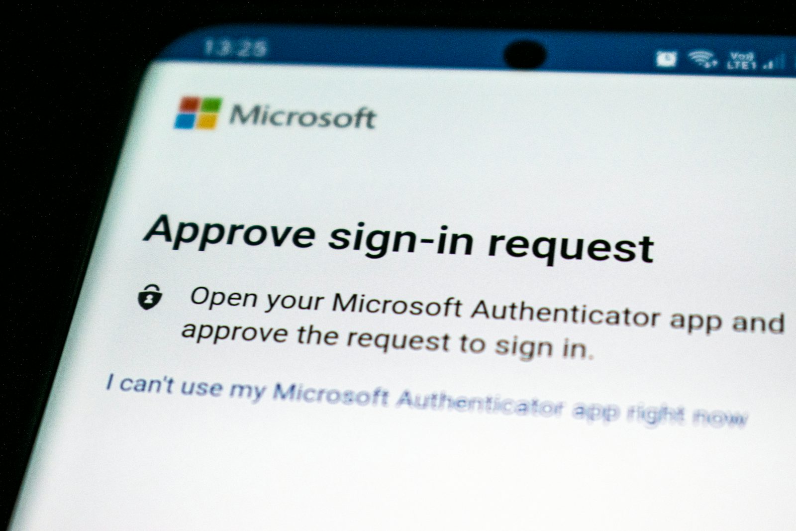 Two factor authentication login screen on smartphone illustrating iPhone security settings that help protect against Apple spyware threats