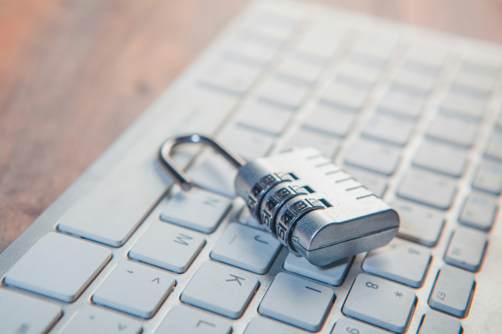 Padlock resting on a laptop keyboard, representing the best antivirus software for protecting your devices in 2026