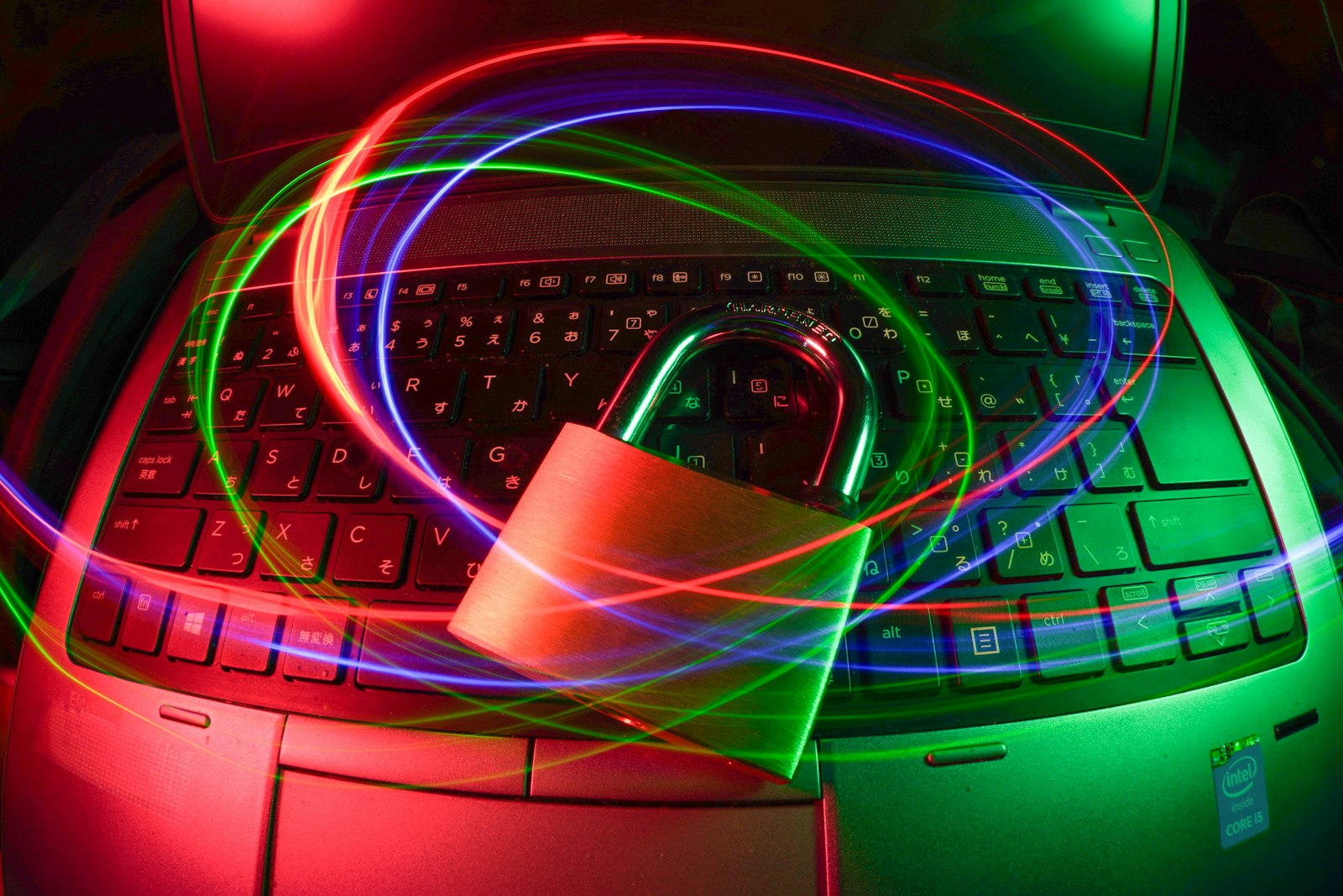 Padlock glowing on a laptop with light trails, illustrating real-time malware protection from the best antivirus software