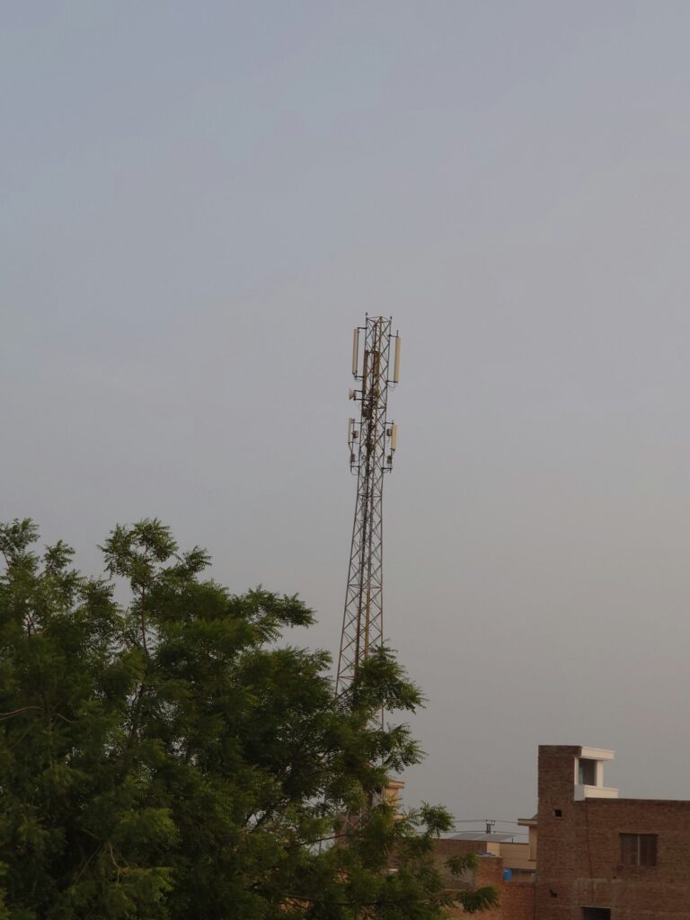Cell phone tower against the sky, representing the 5G networks behind the best cell phone plans of 2026