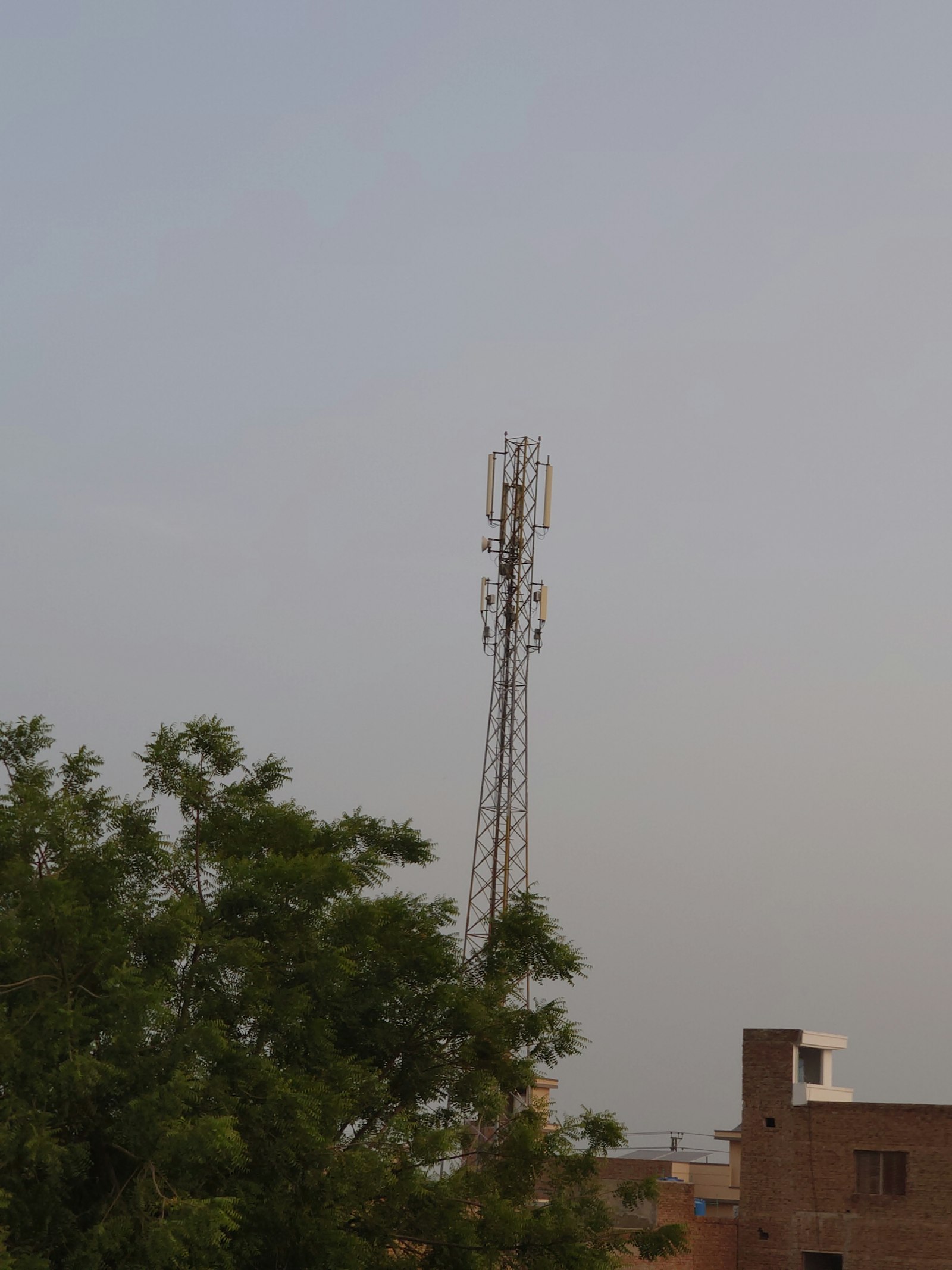 Cell phone tower against the sky, representing the 5G networks behind the best cell phone plans of 2026