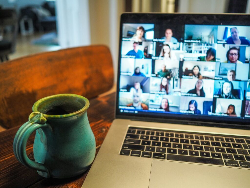 MacBook Pro displaying a group video call, representing the best video conferencing software options in 2026