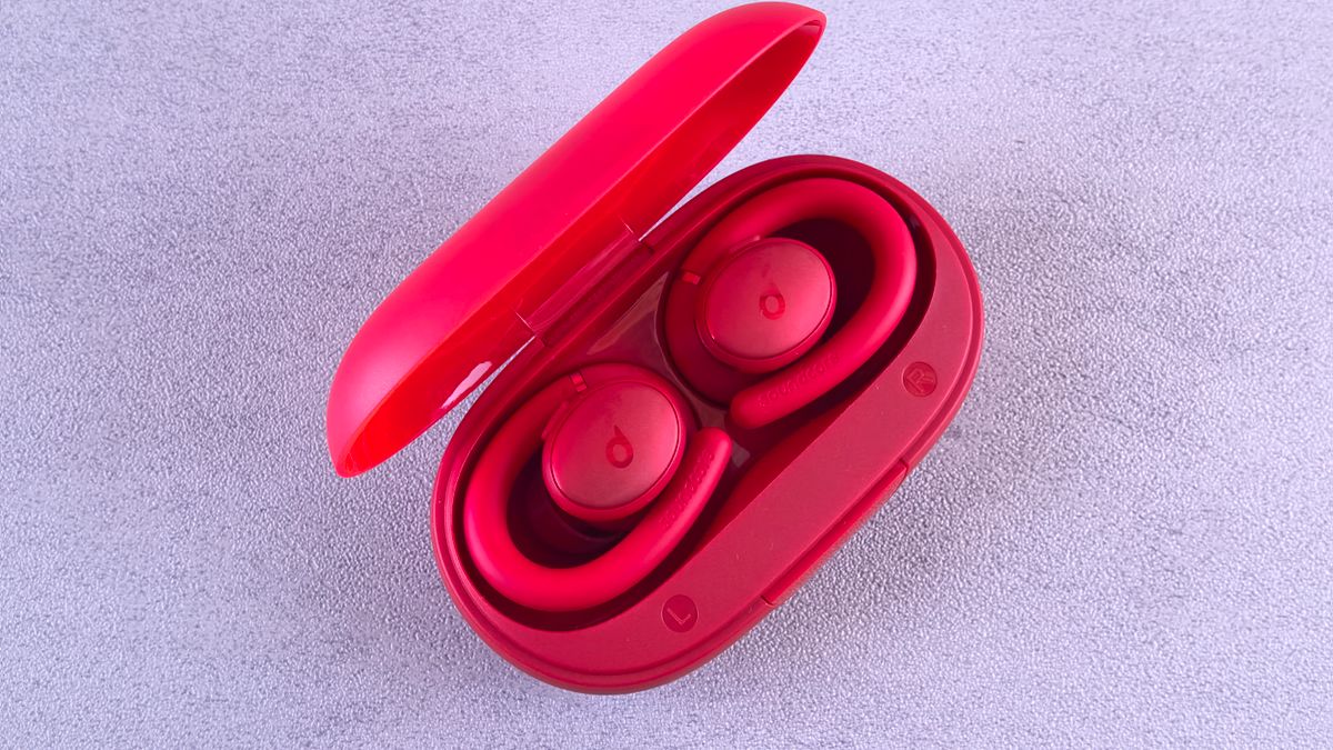 Red wireless earbuds with charging case, representing the best budget TWS earbuds under ₹2000