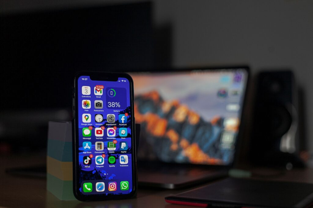 Person playing a mobile battle royale game on a smartphone, representing the BGMI x CarryMinati playable character collaboration