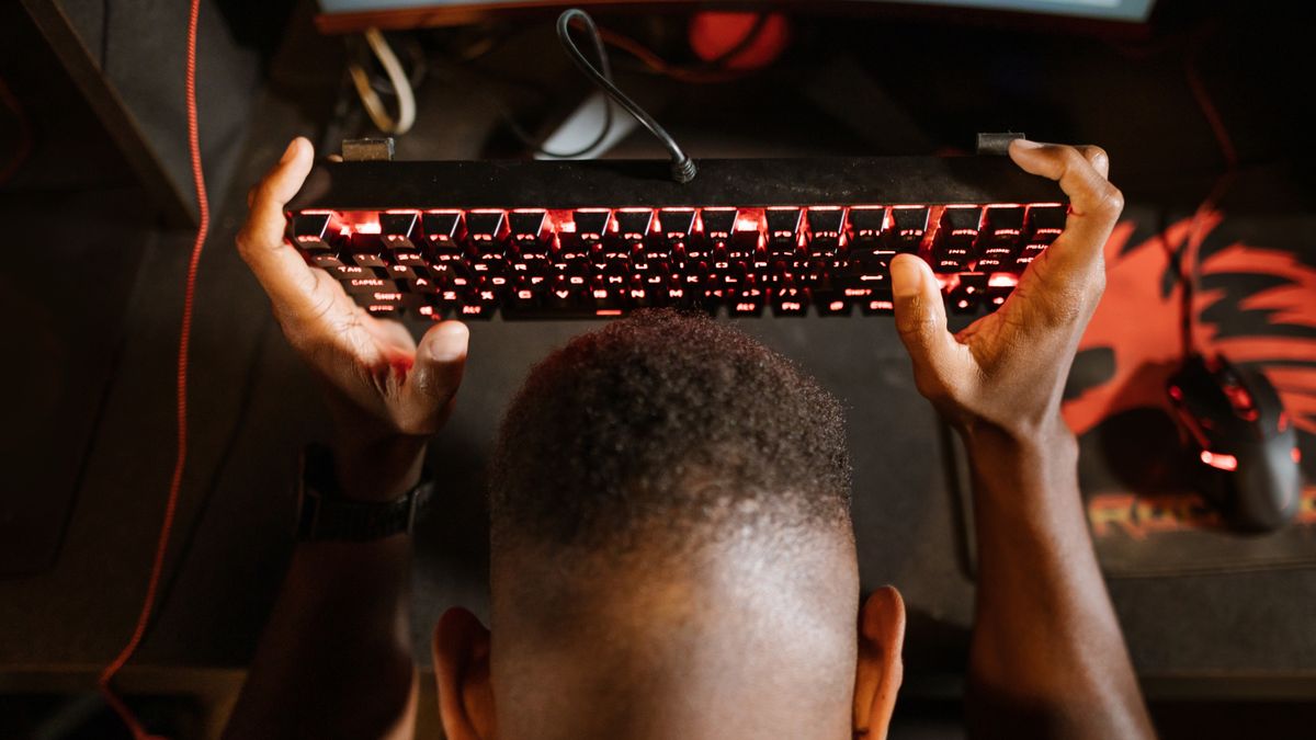 Young gamer excitedly playing a mobile battle royale game on smartphone, representing BGMI Royale Pass rewards
