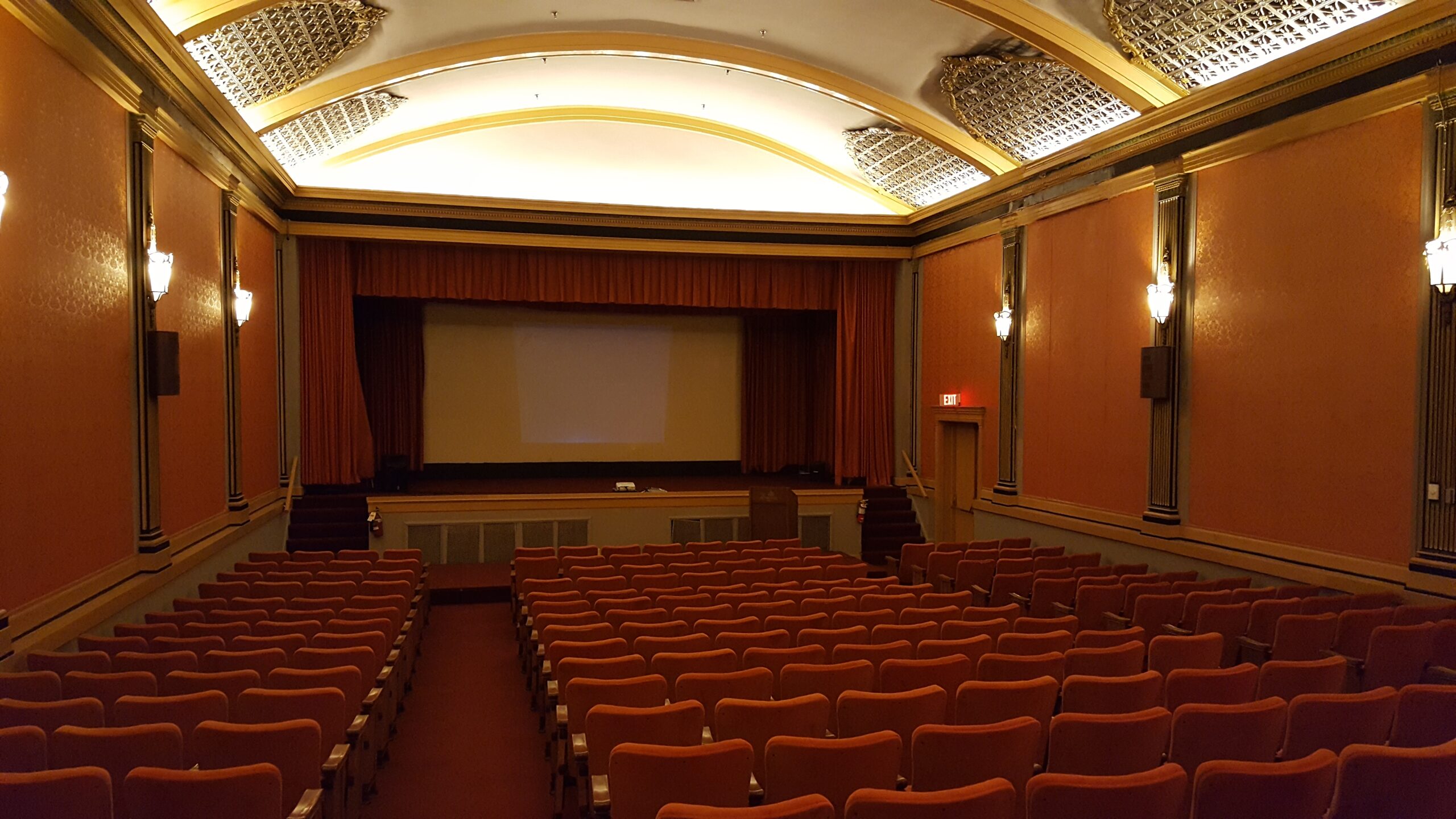 Empty movie theater screen and seats, representing the 2028 theatrical release of Days of Thunder 2