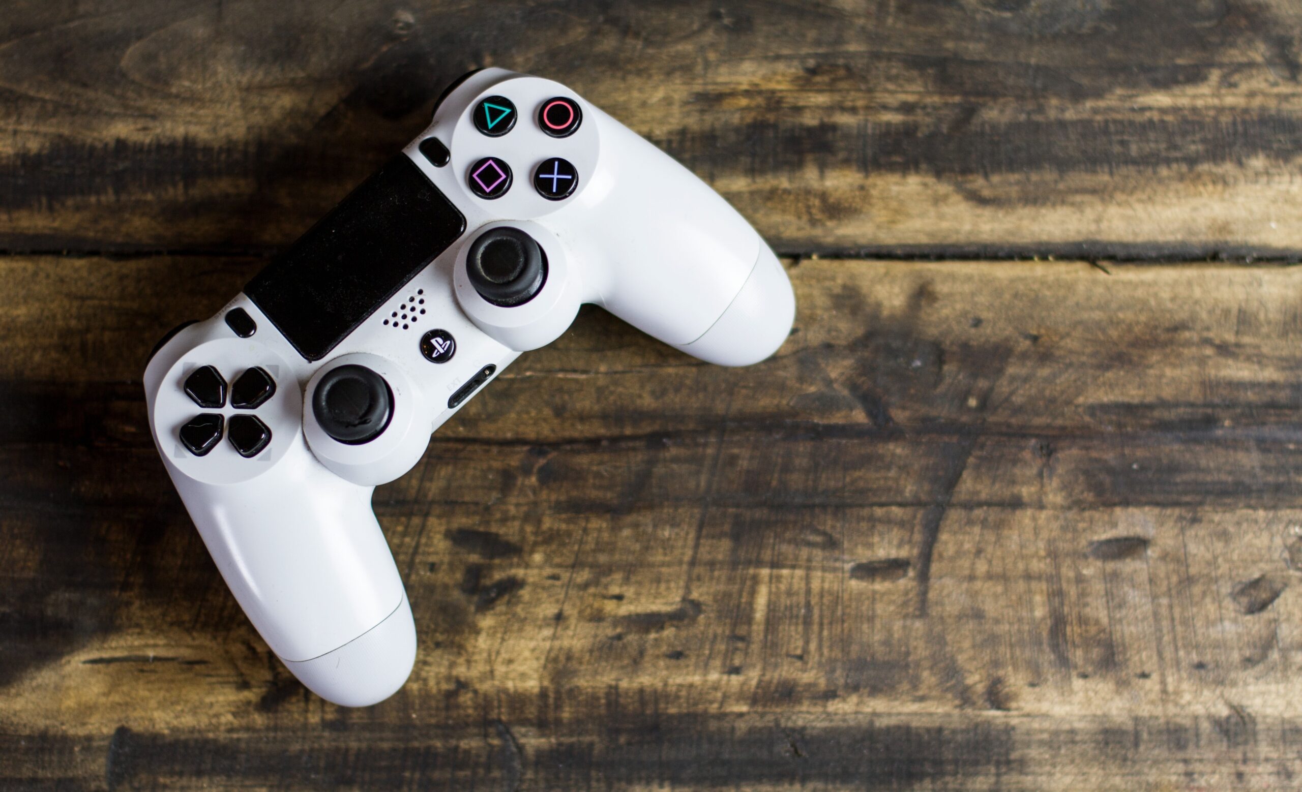 Person gaming on a smart TV setup with a controller, representing GeForce NOW cloud gaming streamed to a TV in India