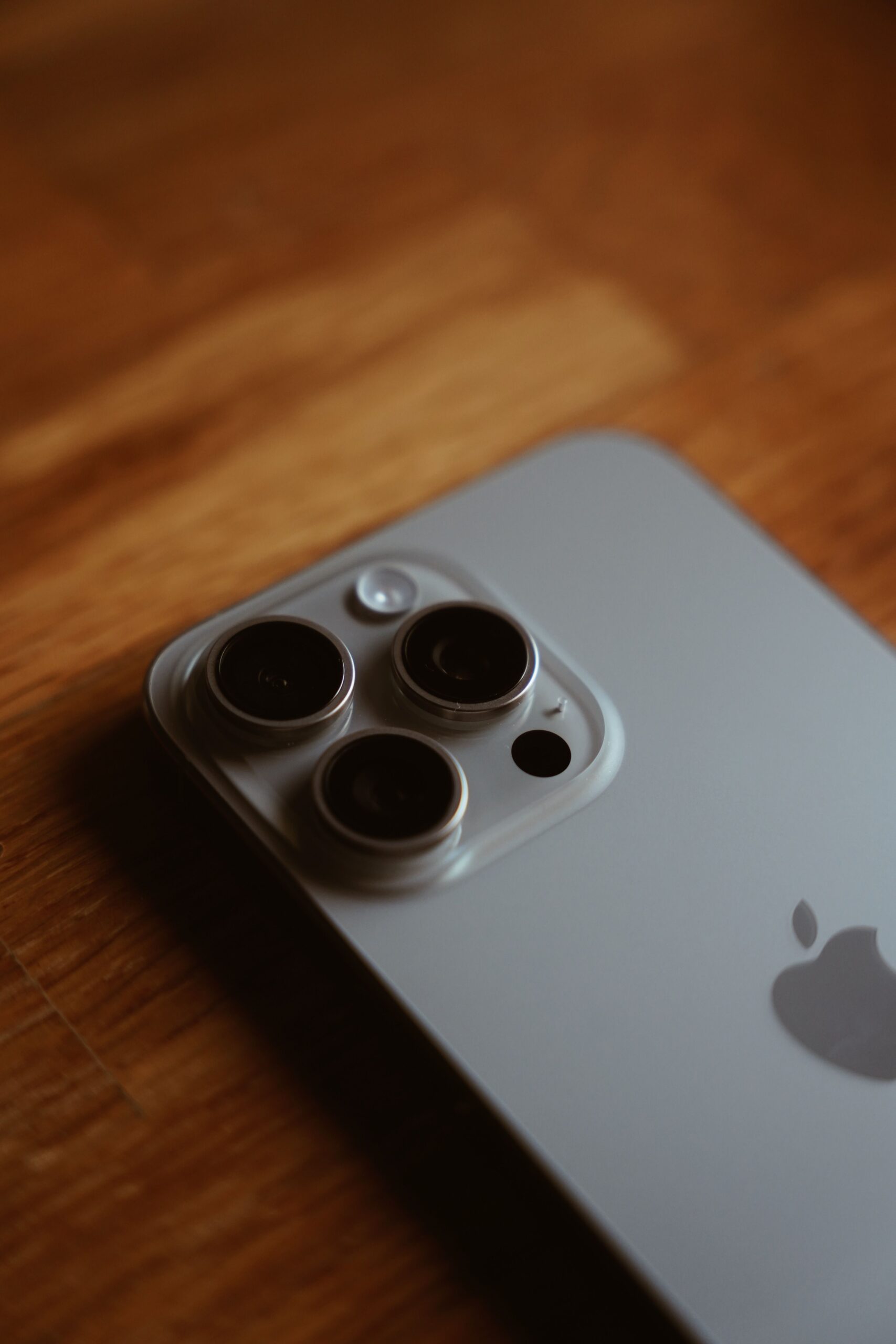 Close-up of an iPhone triple camera module, representing the expected iPhone 18 Pro variable-aperture camera upgrade