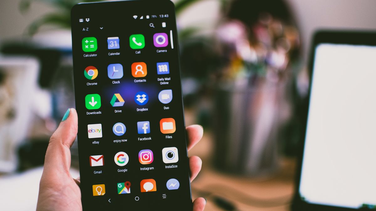 Person taking a photo with a smartphone camera, representing the Google Pixel 11's upgraded camera system