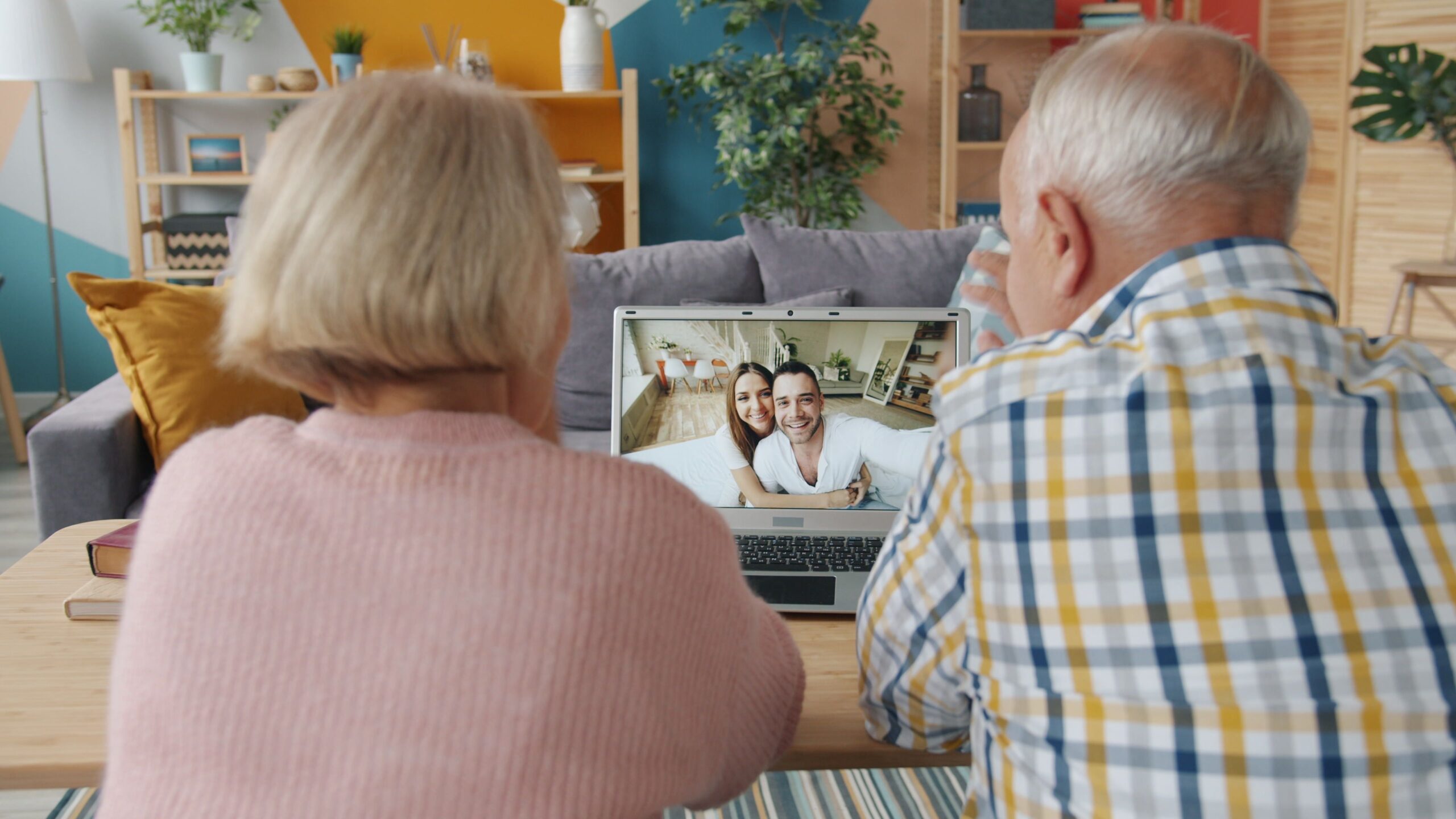 Senior couple checking benefits on a laptop to see their Social Security COLA 2027 payment increase