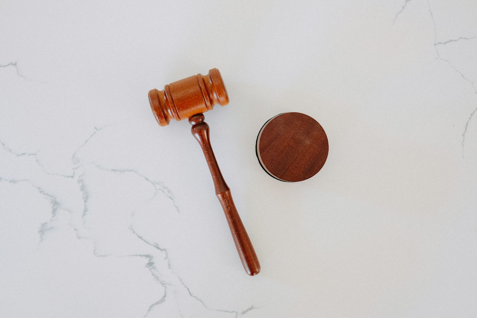 Wooden gavel on marble representing the DOJ legal settlement with TikTok over COPPA child privacy violations