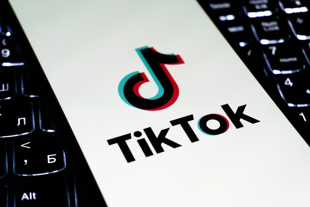 TikTok logo displayed on a smartphone screen representing the 400 million dollar DOJ child privacy settlement