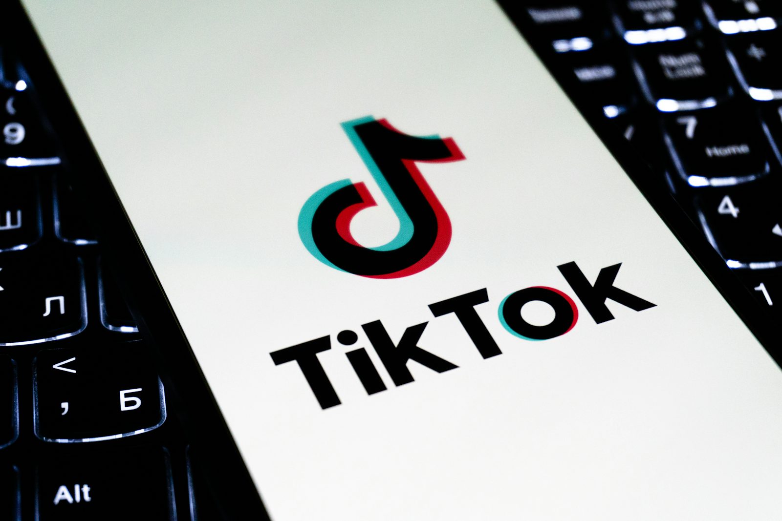 TikTok logo displayed on a smartphone screen representing the 400 million dollar DOJ child privacy settlement