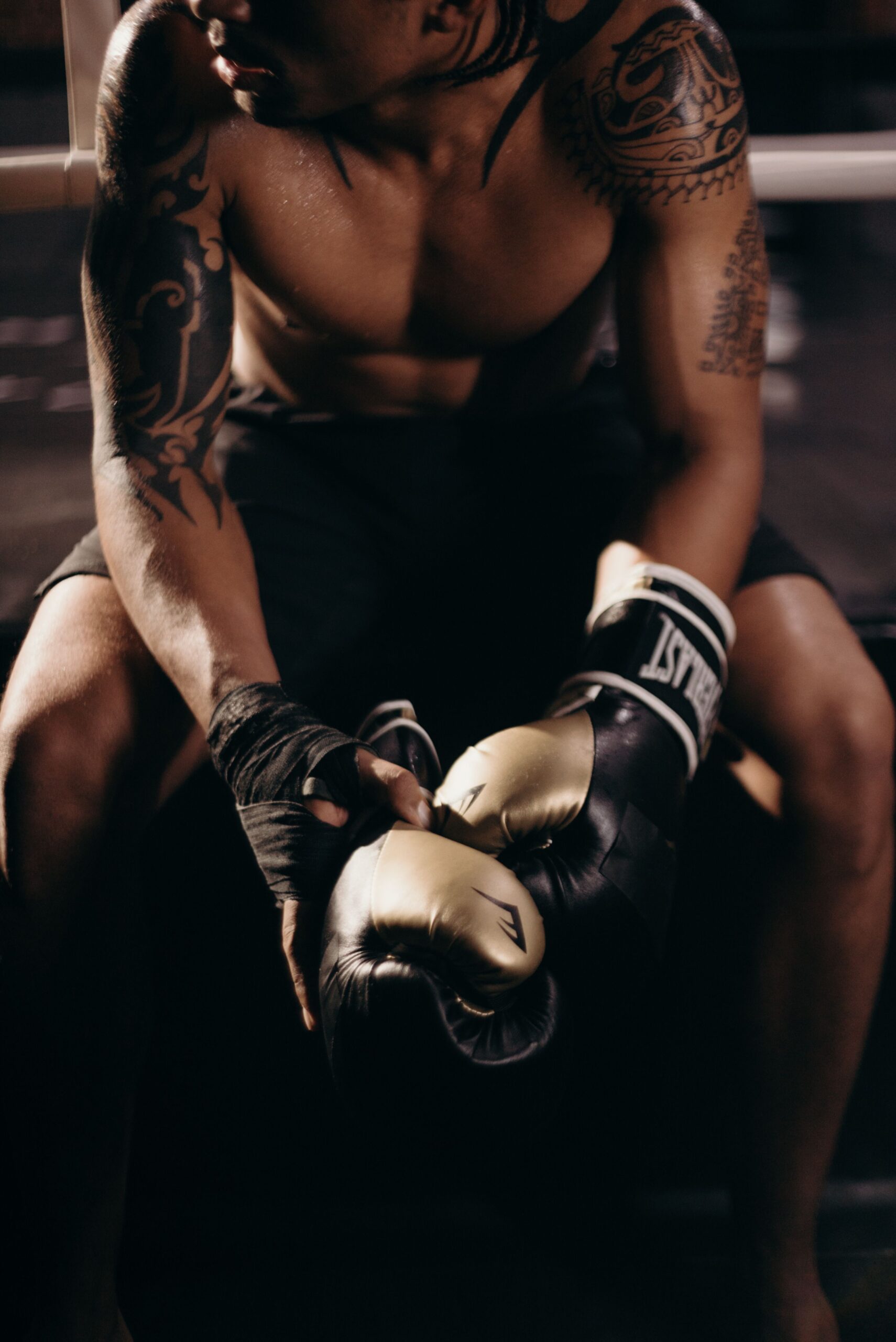 MMA fighter training with boxing gloves in a gym, representing UFC 330 fight card results and highlights