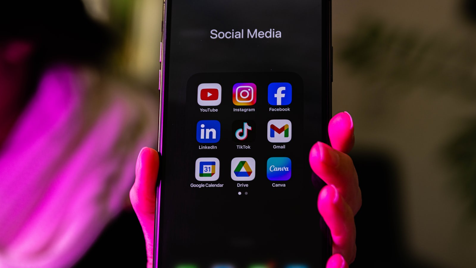 Smartphone displaying multiple app icons representing Elon Musk's vision of X as an everything app combining social media and payments