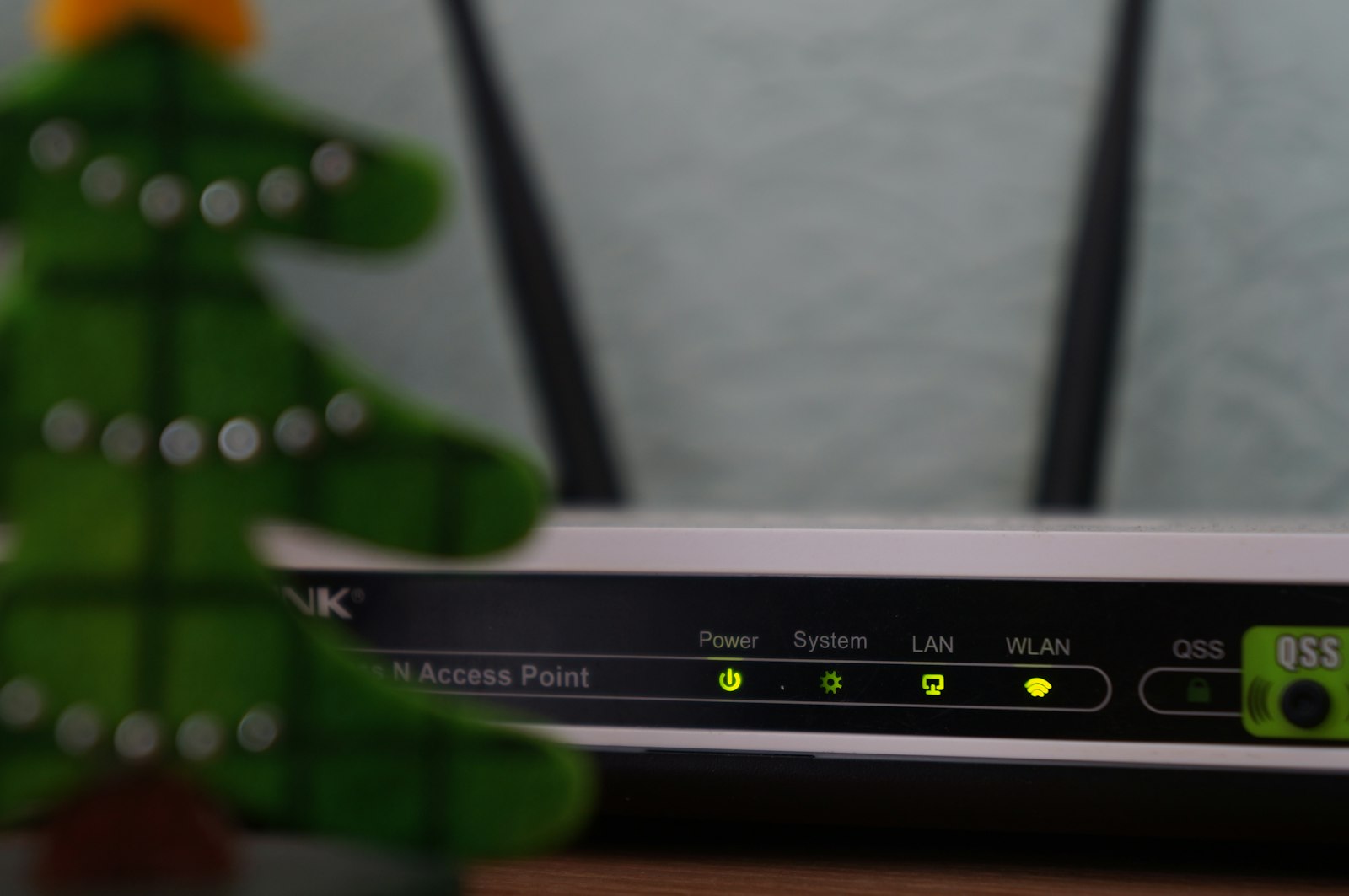 Black and white modem with indicator lights, representing the home internet setup compared between Xfinity and Spectrum in 2026
