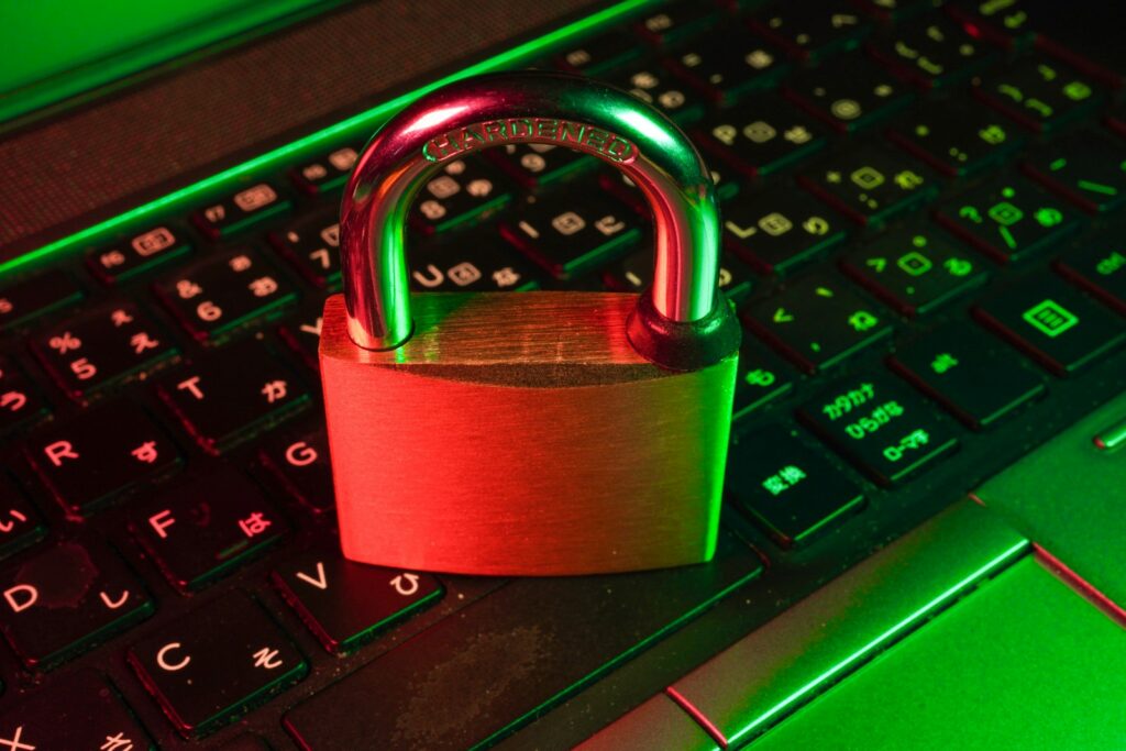 Red padlock resting on a black computer keyboard, representing the ransomware attack that exposed ATF investigation files in the 2026 Qilin data breach