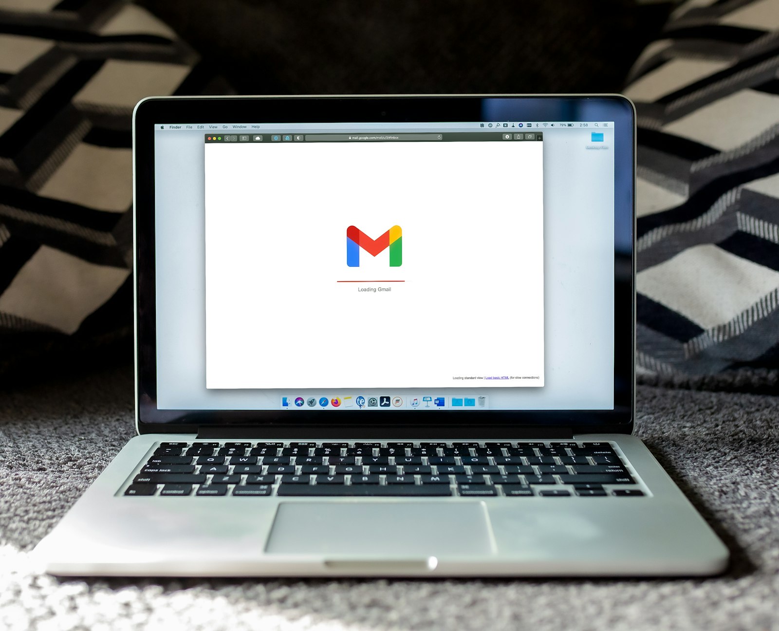 MacBook Pro on a desk used for building email marketing campaigns, illustrating the best email marketing software 2026 comparison