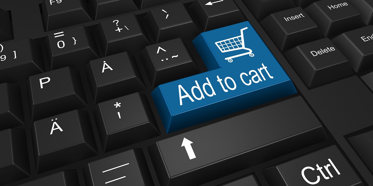 Online shopping cart icon on a laptop screen, representing the discontinued Costco Next online marketplace