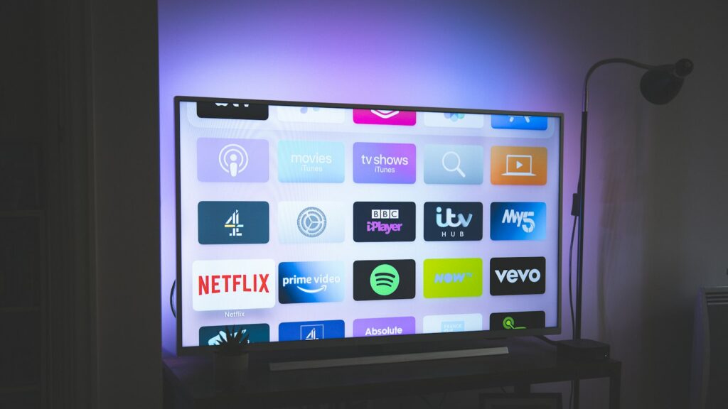 TV screen showing streaming app icons, illustrating the Disney Plus price increase for 2026