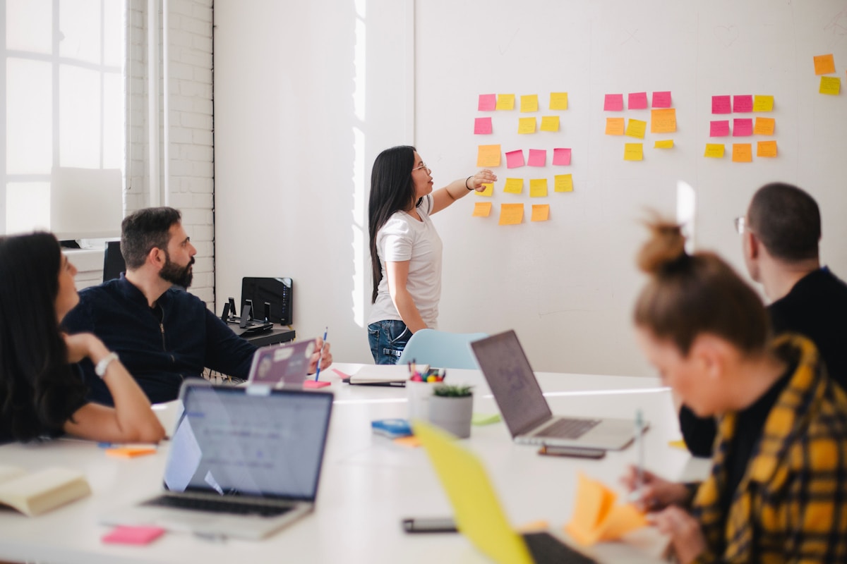Team reviewing email marketing metrics and conversion data with AI tools