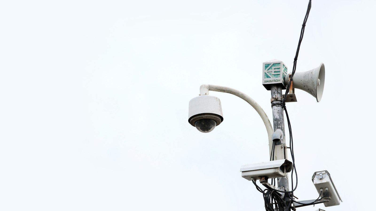 Surveillance camera mounted on a street light pole, illustrating the Flock camera hack that exposed 1.6 million images