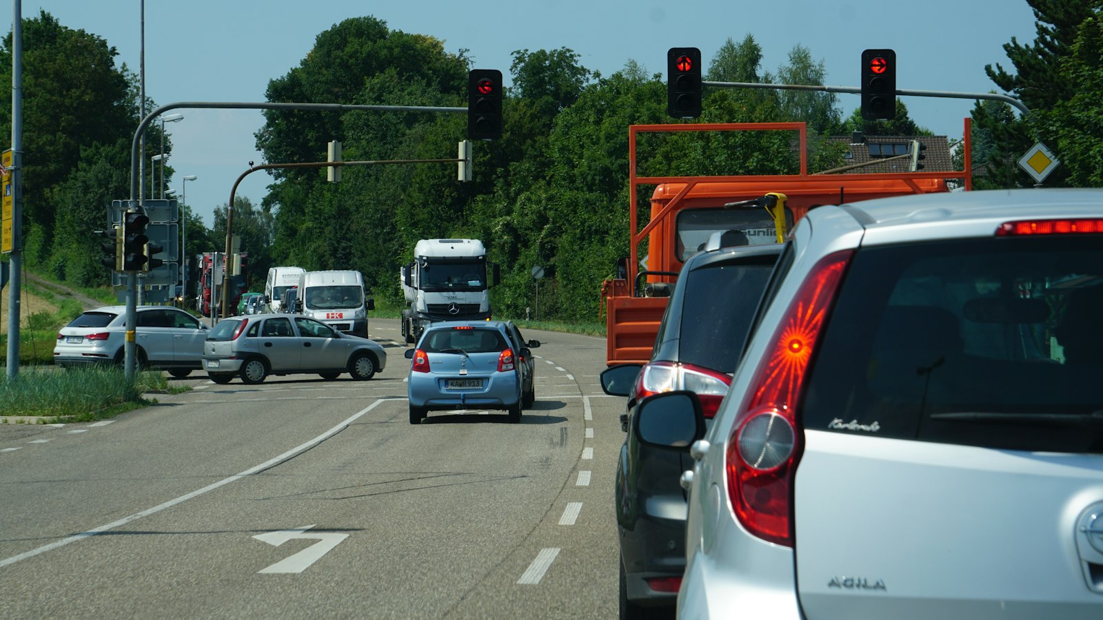 Cars driving on a highway, representing the 50,200 vehicles photographed by one camera in the Flock camera hack