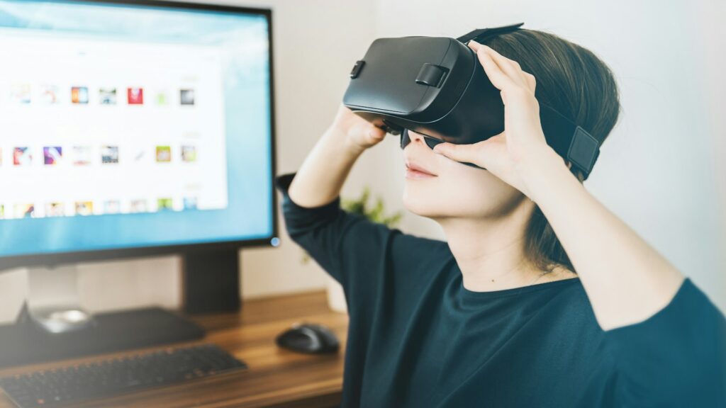 Person wearing a VR headset at a desk, representing the Meta VR Glasses unveiled at Meta Connect 2026