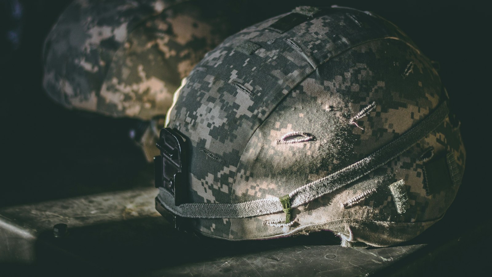 Military helmet on a table, symbolizing service member records exposed in the Pentagon data breach at DMDC