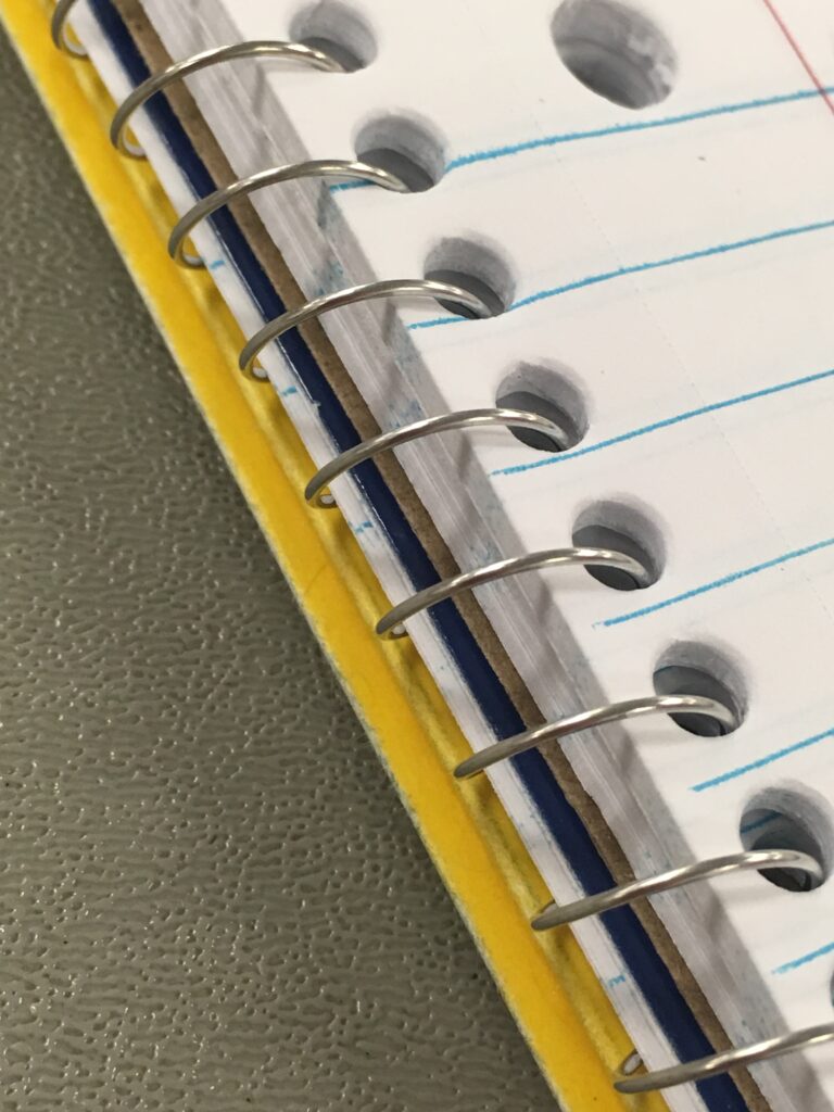 Notebook and planner representing personal productivity organized with artificial intelligence tools