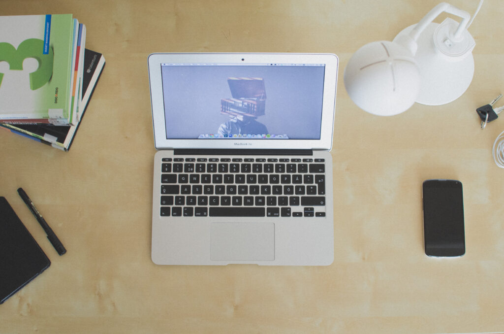 Laptop on a home desk representing remote work productivity tools for career growth