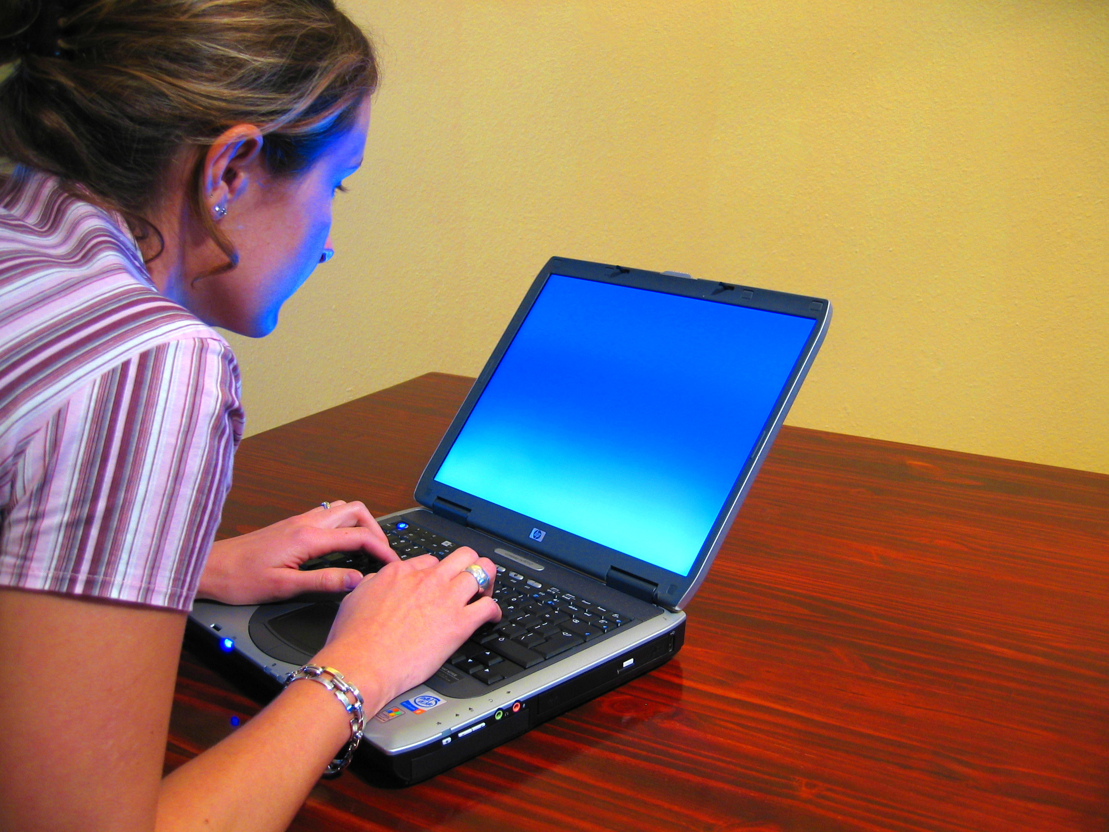 Remote Work Productivity Career Typing Professional typing on a laptop while managing remote work tasks for career growth