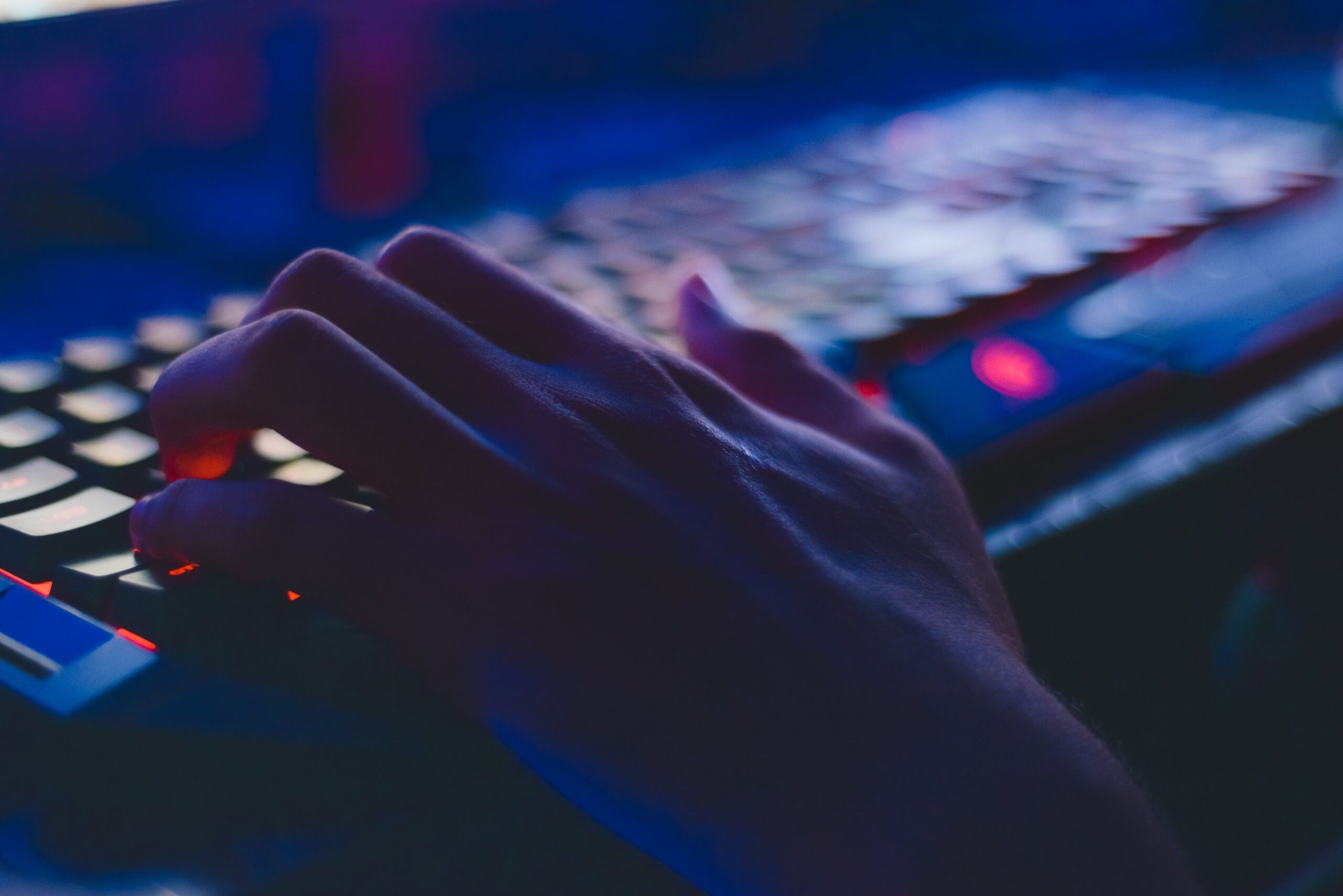 Hands typing on a laptop keyboard representing startup productivity for blogging and SEO