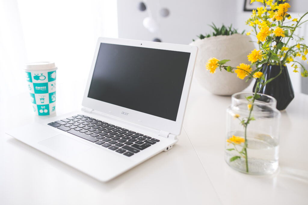 Coffee and laptop on a desk representing video content creation with AI tools