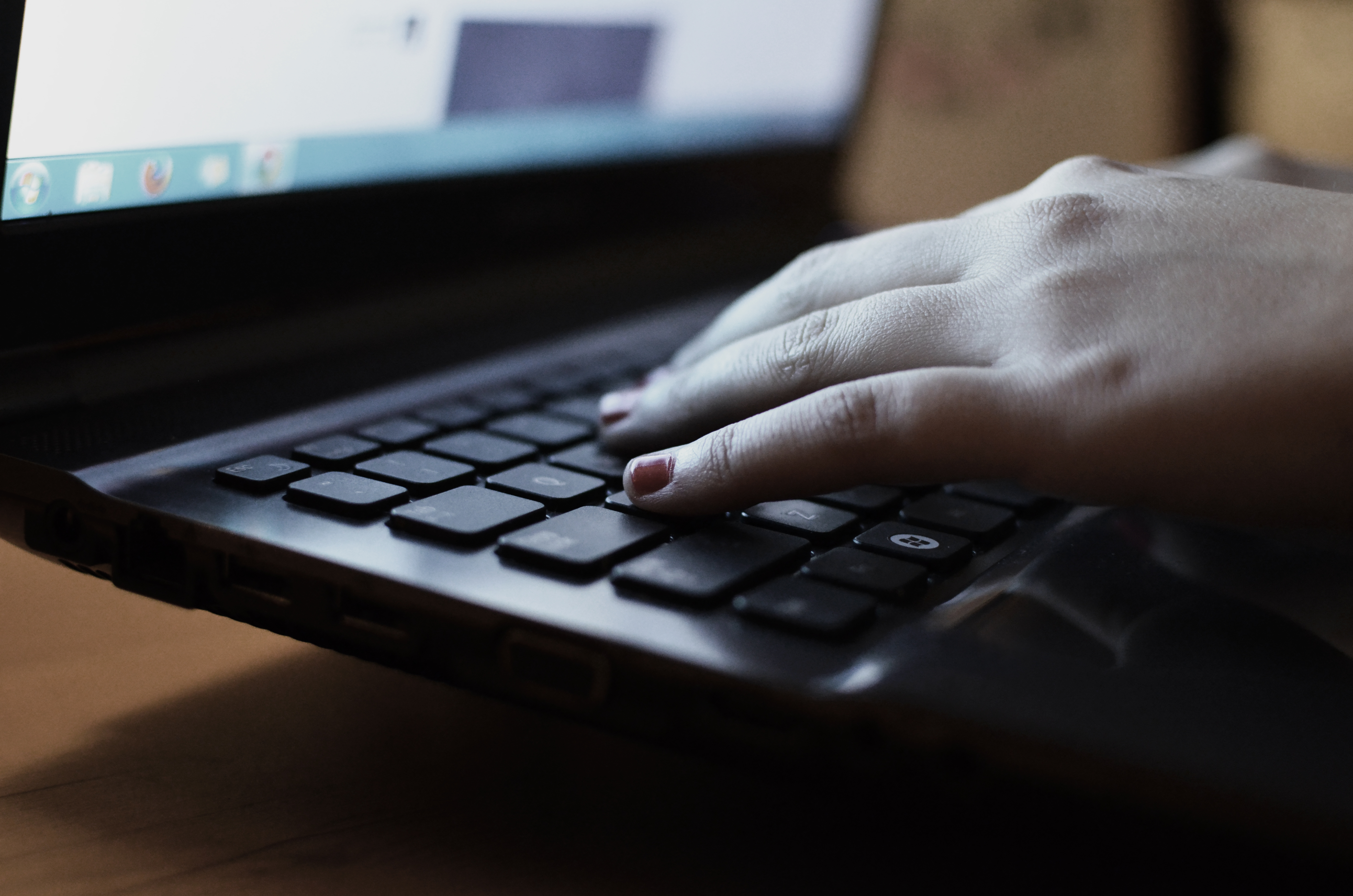 Hands typing on a laptop setting up workflow automation for a blog's SEO content pipeline